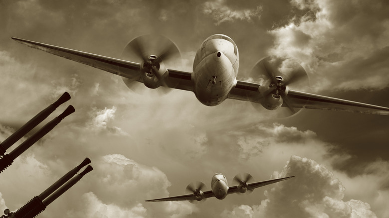 warplanes fly past AAA