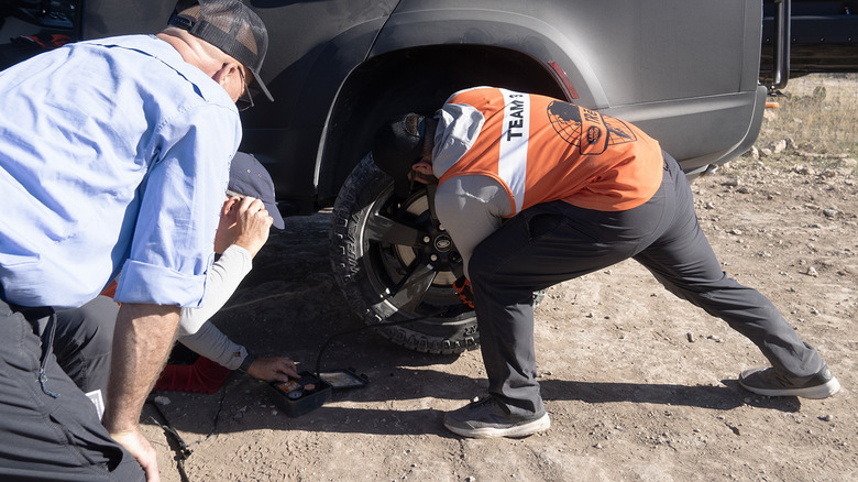 Swapping a rear tire at Land Rover TReK
