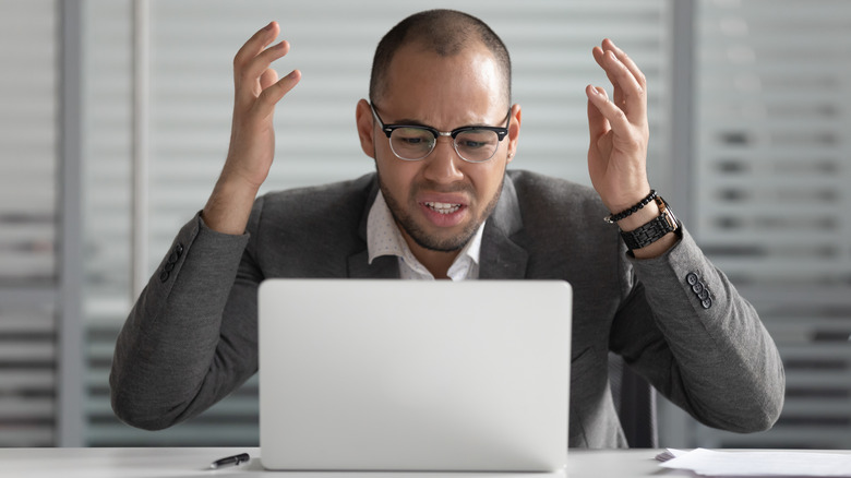 laptop man frustrated