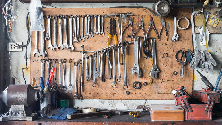 A wall of tools in a garage workshop