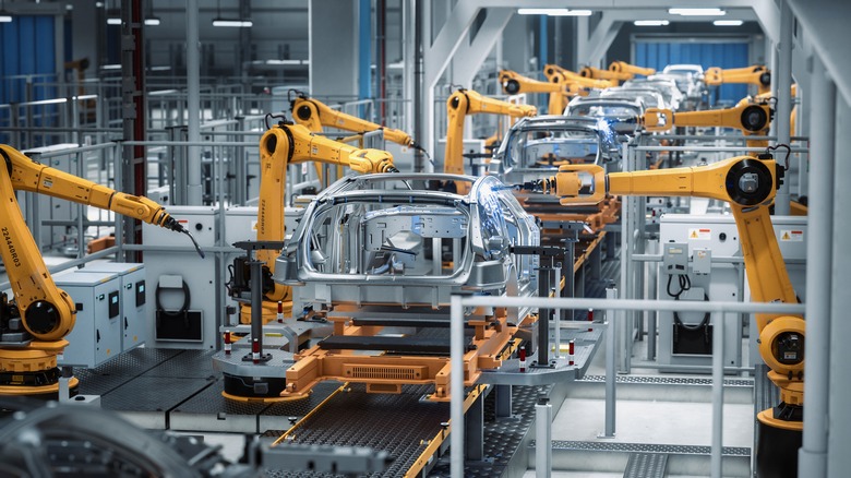 Robots making cars in factory