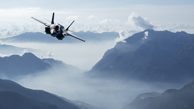 An F-35 Lightning II soars over the Italian alps.
