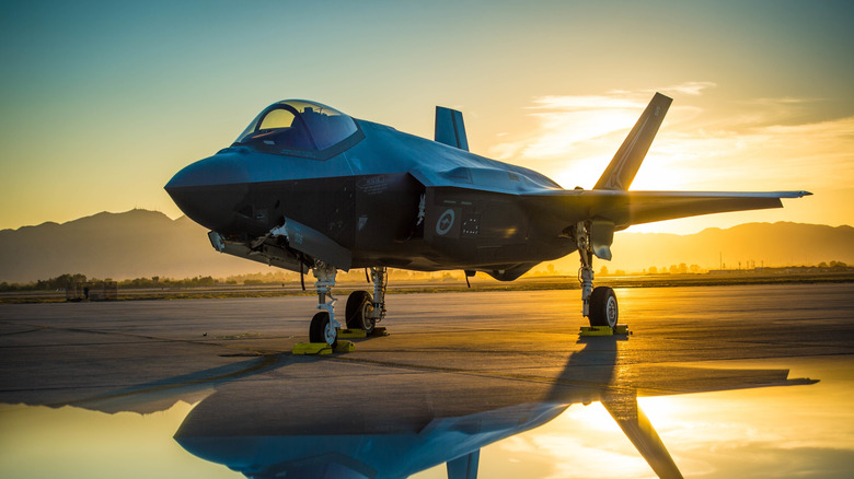 F-35 Lightning II on a runway at sunset