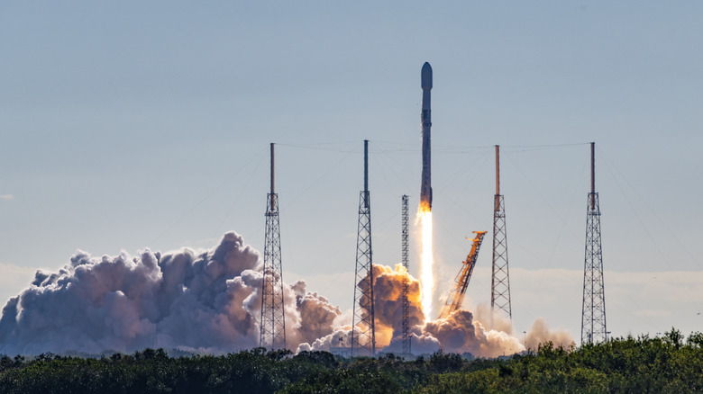 Clouds billow from the ground as SpaceX launches rocket in Florida