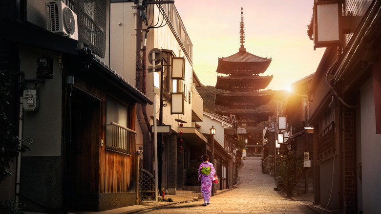 Geisha walking towards a temple