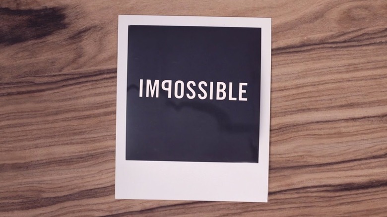 Instant photo with the word "impossible"