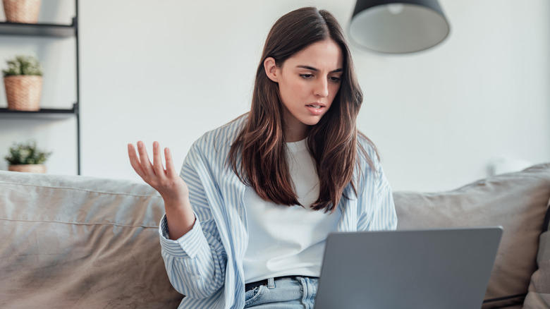 Woman frustrated with laptop