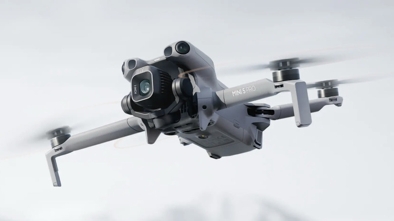 DJI Mini series drone in air.