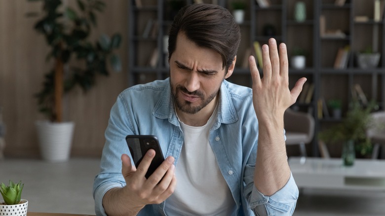 Frustrated man with phone