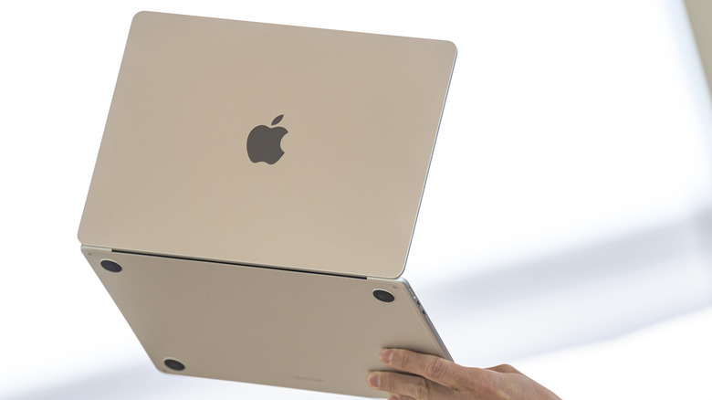MacBook Air held aloft