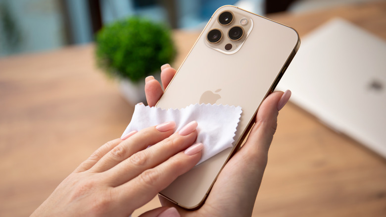wiping iPhone with cloth