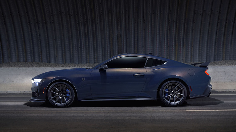 Side view of blue Ford Mustang Dark Horse in tunnel.