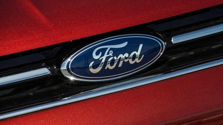 Ford logo on grill of red Ford Focus