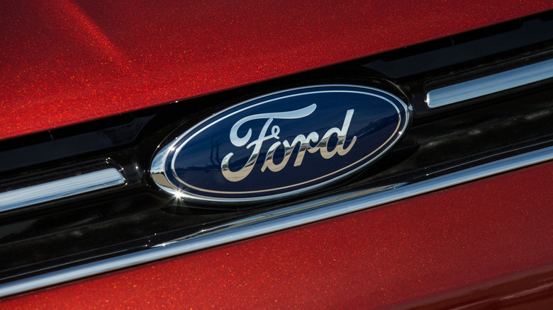 Ford logo on grill of red Ford Focus