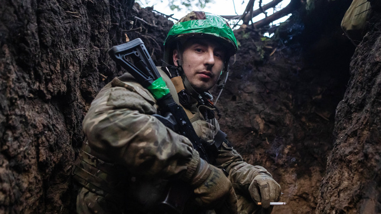 Ukrainian solider in Bakhmut trench