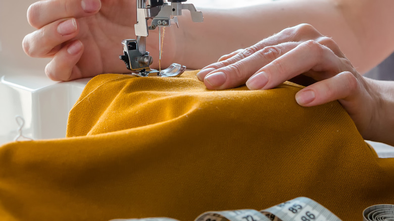 fabric held under sewing machine