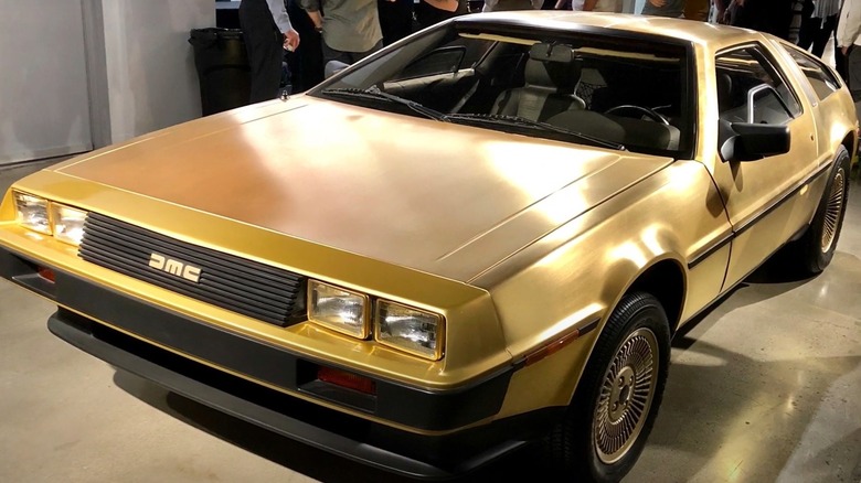 Gold DeLorean parked at museum