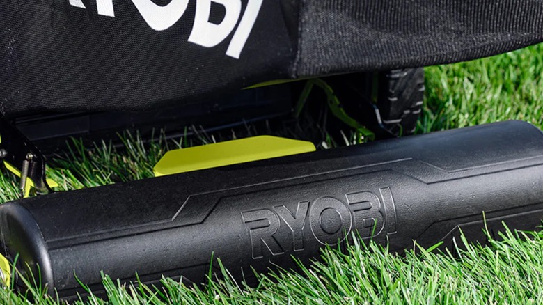 The Ryobi Lawn Mower Striper on the back of a mower