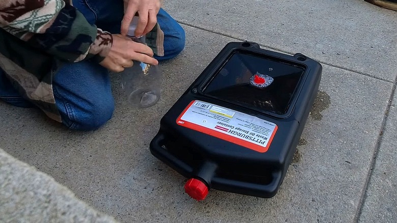 A Pittsburgh Waste Oil Storage Container on the ground