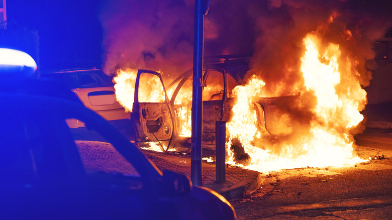A car burning on the road