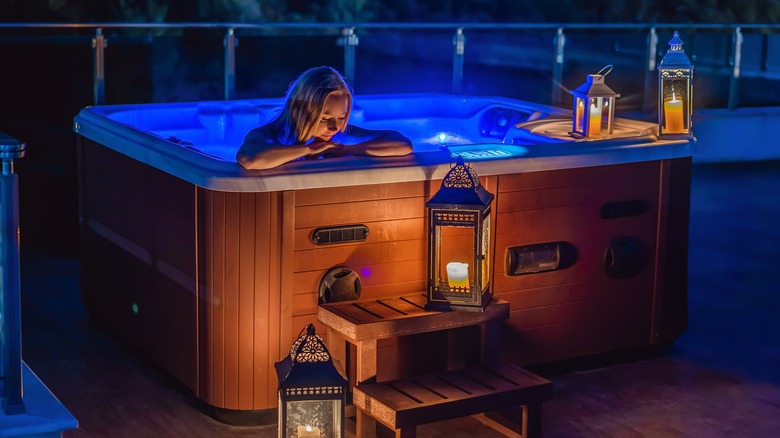 Person soaking in hot tub