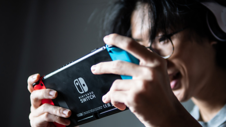 Man playing Nintendo Switch