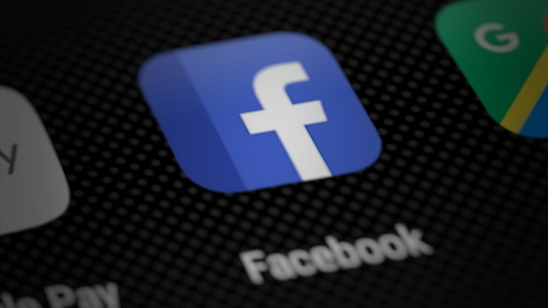 The Facebook app icon on a smartphone