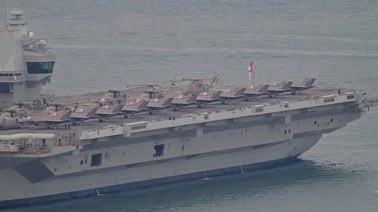 UK aircraft carrier HMS Prince Of Wales at Sea with deck full of jets