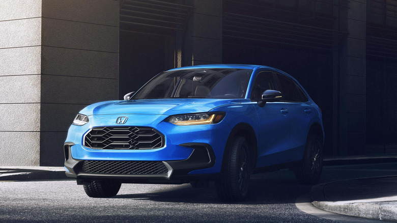 Front 3/4 view of a blue Honda HR-V in urban setting