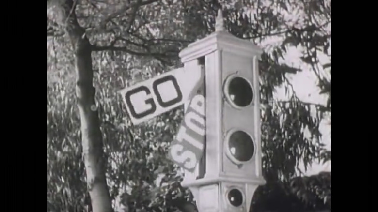 A traffic light with "stop" and "go arms like the one installed in Los Angeles in 1920