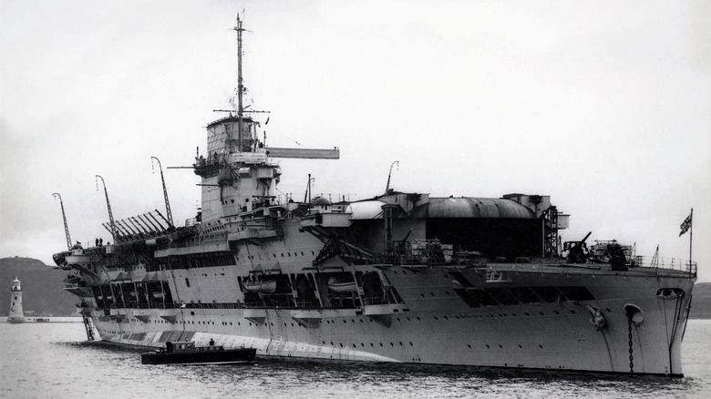 The HMS Glorious stands anchored in the Plymouth Sound.