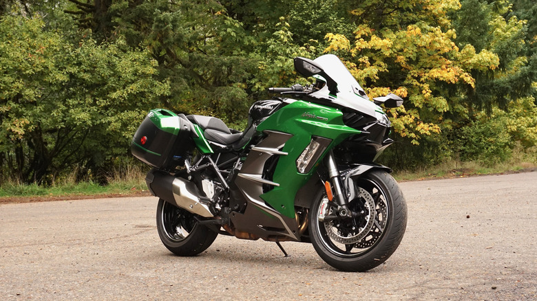 Kawasaki Ninja H2 SX parked in the forest