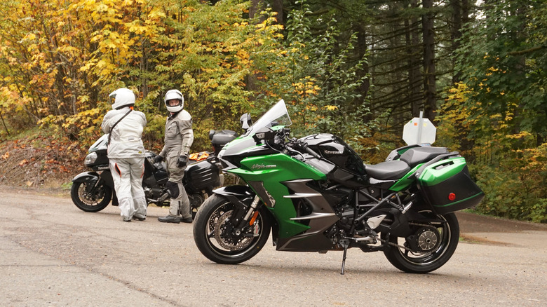 Kawasaki Ninja H2 SX parked in the forest