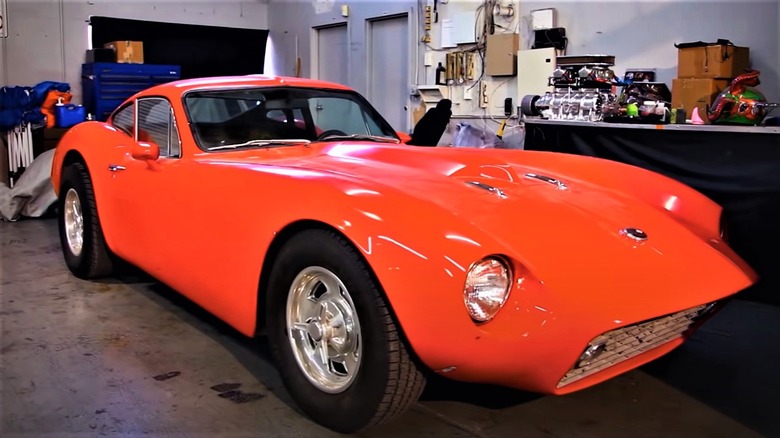 bright red Kellison J6 in garage