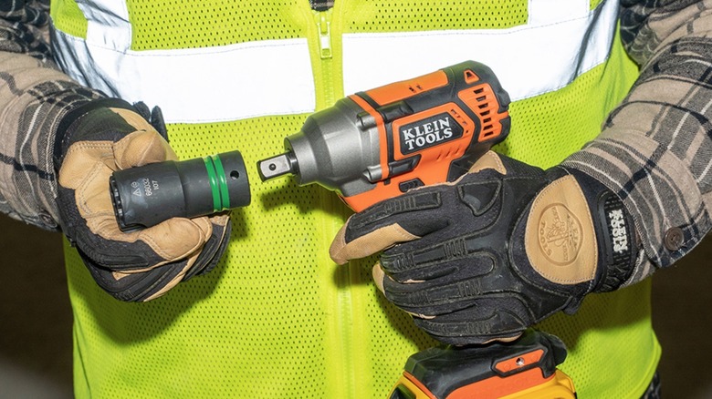 Person using one of Klein Tools' 2-in-1 sockets