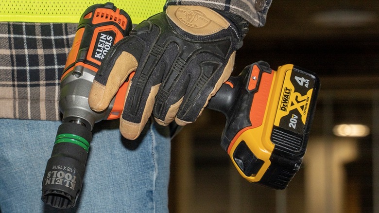 Person holding Klein Tools poer drill with 2-in-1 socket attached