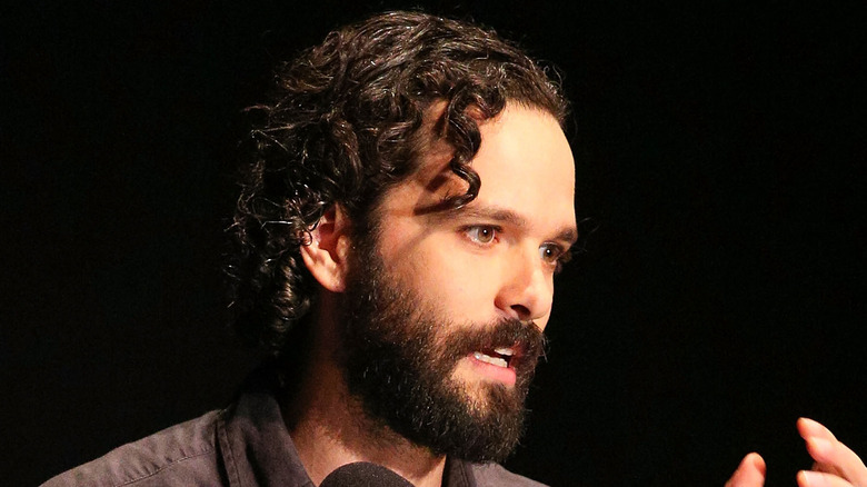 Neil Druckmann speaking at event