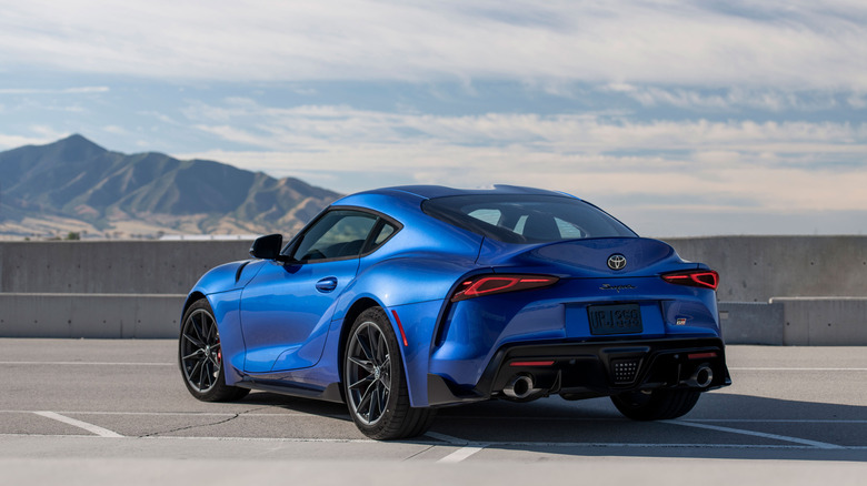 2026 Toyota GR Supra parked in lot, rear-left 3/4 view