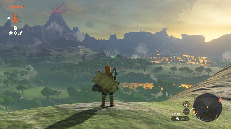 Link parado diante de parte da vasta paisagem de Hyrule