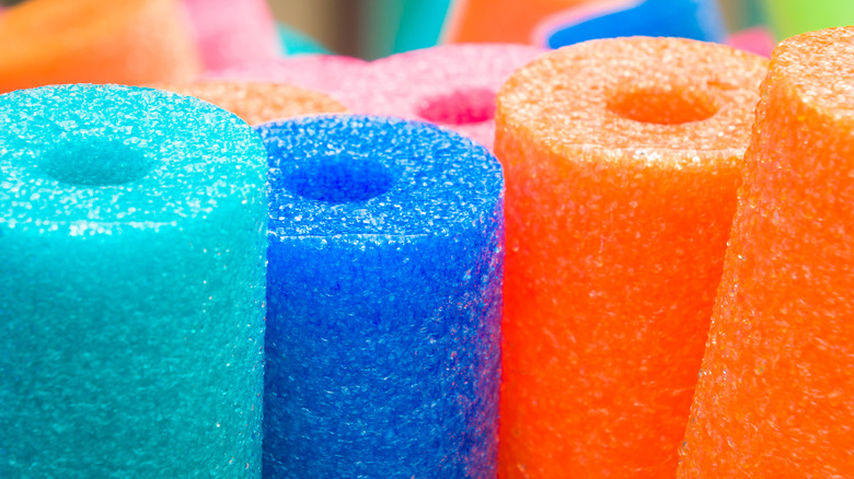 a collection of pool noodles
