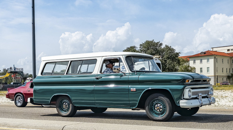 Side-shot of a two-tone 1964 Chevrolet Suburban