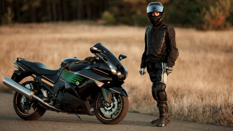 sport bike and rider standing