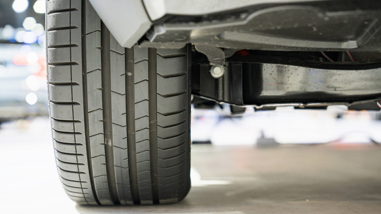Close up of car wheel and undercarriage