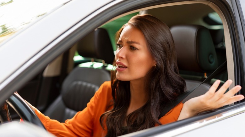 A frustrated driver experiencing stiff gear shifts