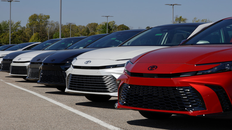 A lineup of 2026 Toyota Camrys in a parking lot.