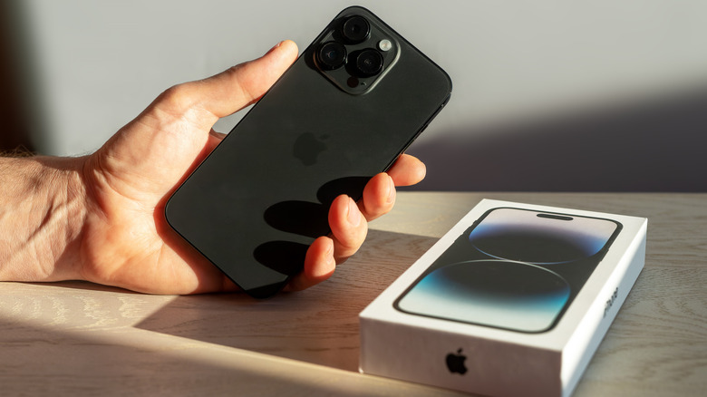 person holding a new iPhone 14 Pro