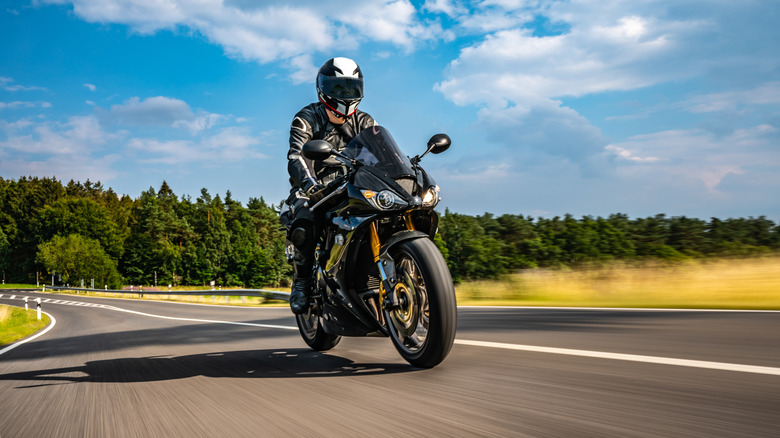 person riding sports bike