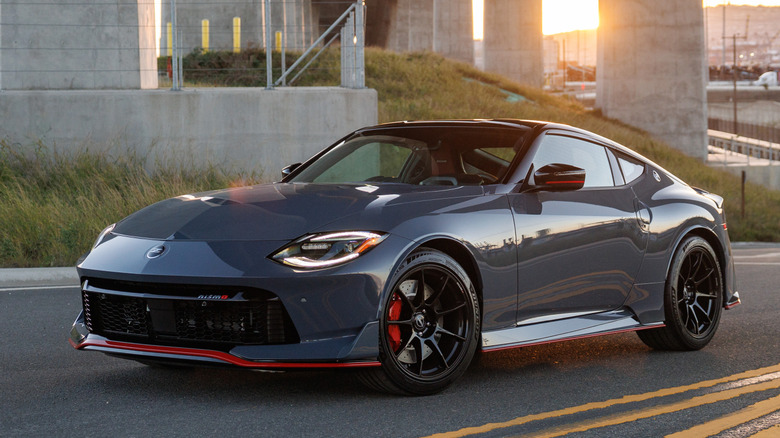 Front 3/4 view of Nissan Z NISMO on road in industrial setting
