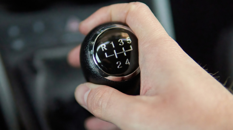 Close shot of hand shifting a manual transmission