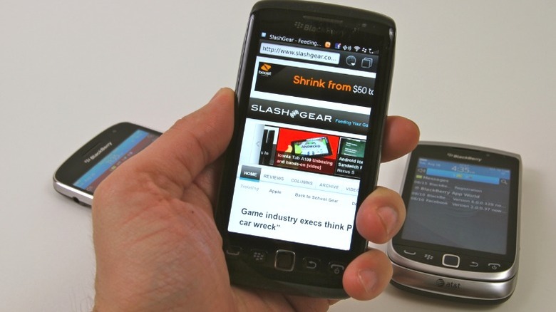 Hand holding BlackBerry Torch 9850